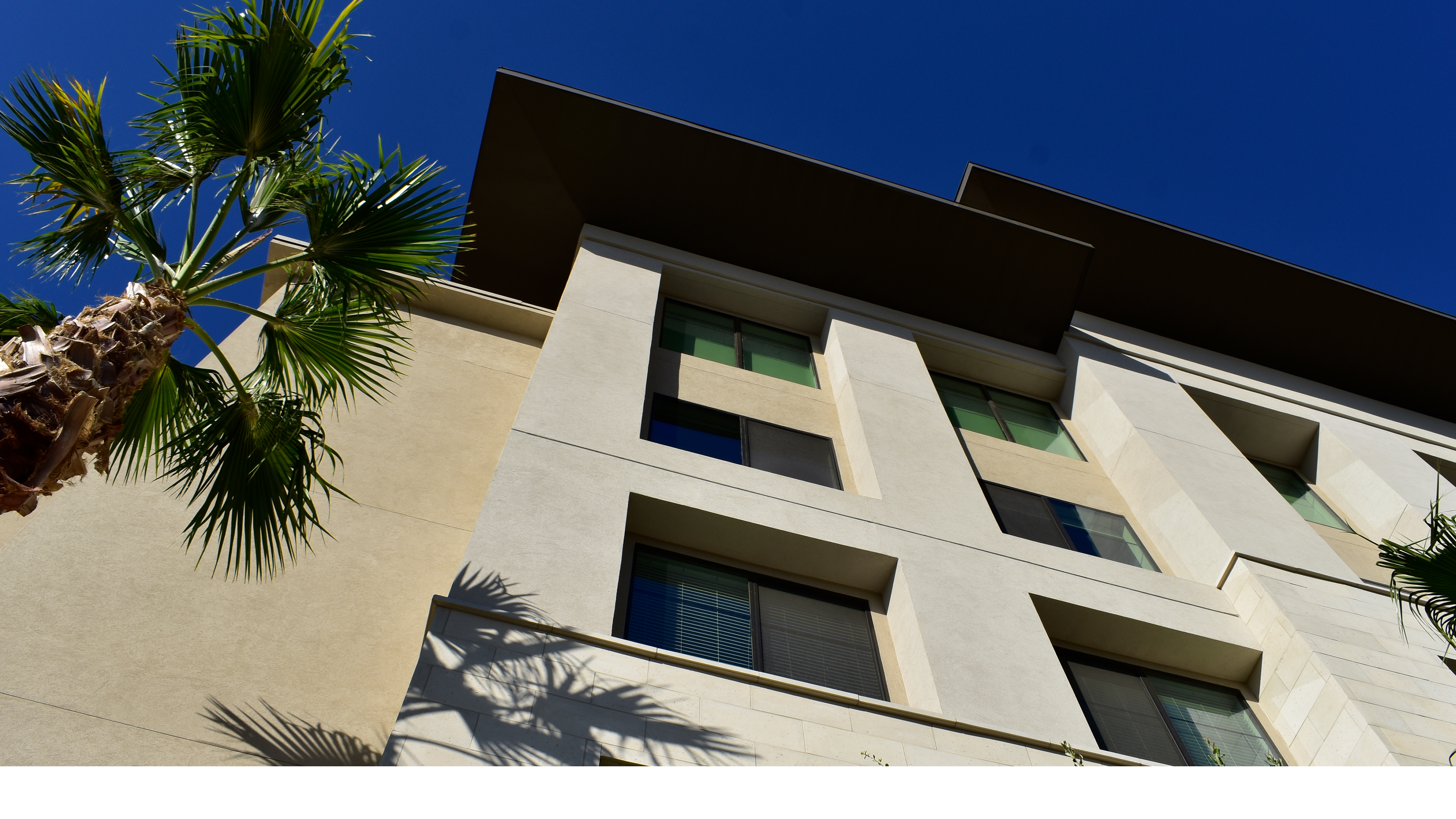 multifamily apartment facade with balconies and stucco exterior in downtown Phoenix Arizona