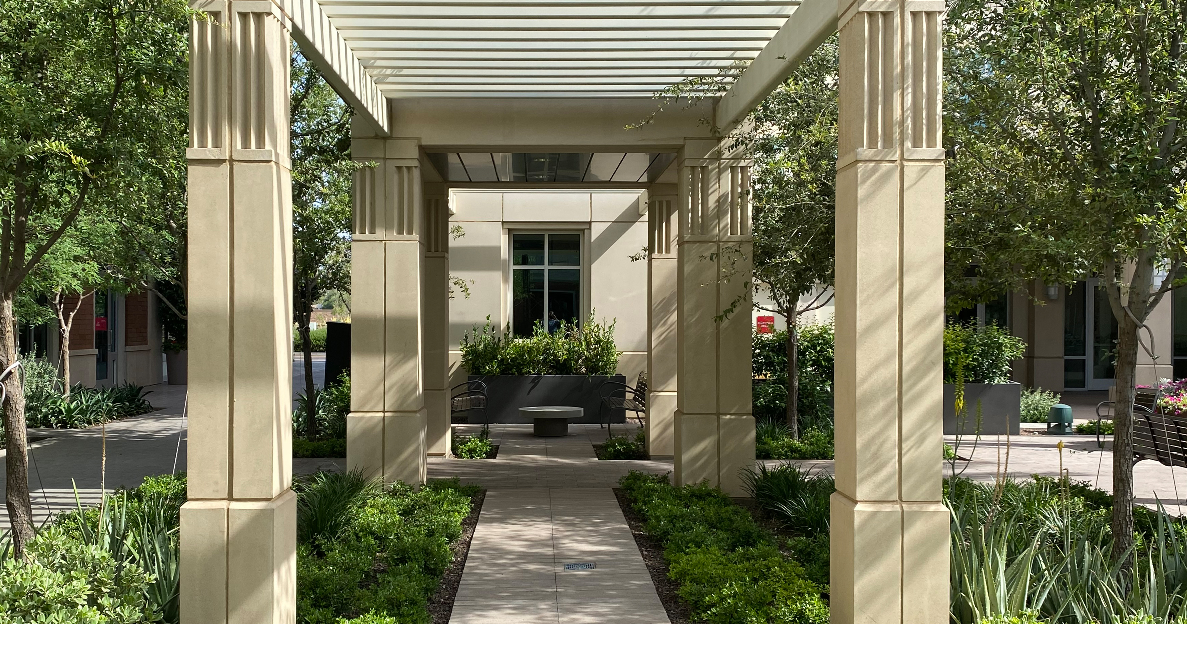 museum courtyard with colonnade and landscaped garden in Mesa Arizona